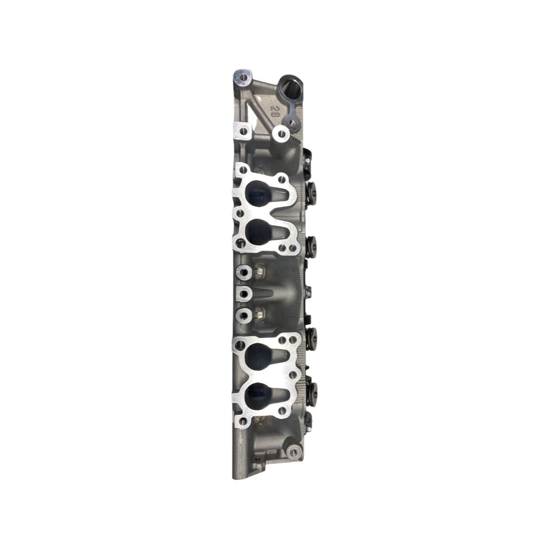 Intake side view of NEW TOYOTA ALUMINUM CYLINDER HEAD SOHC 22R / 22R-E